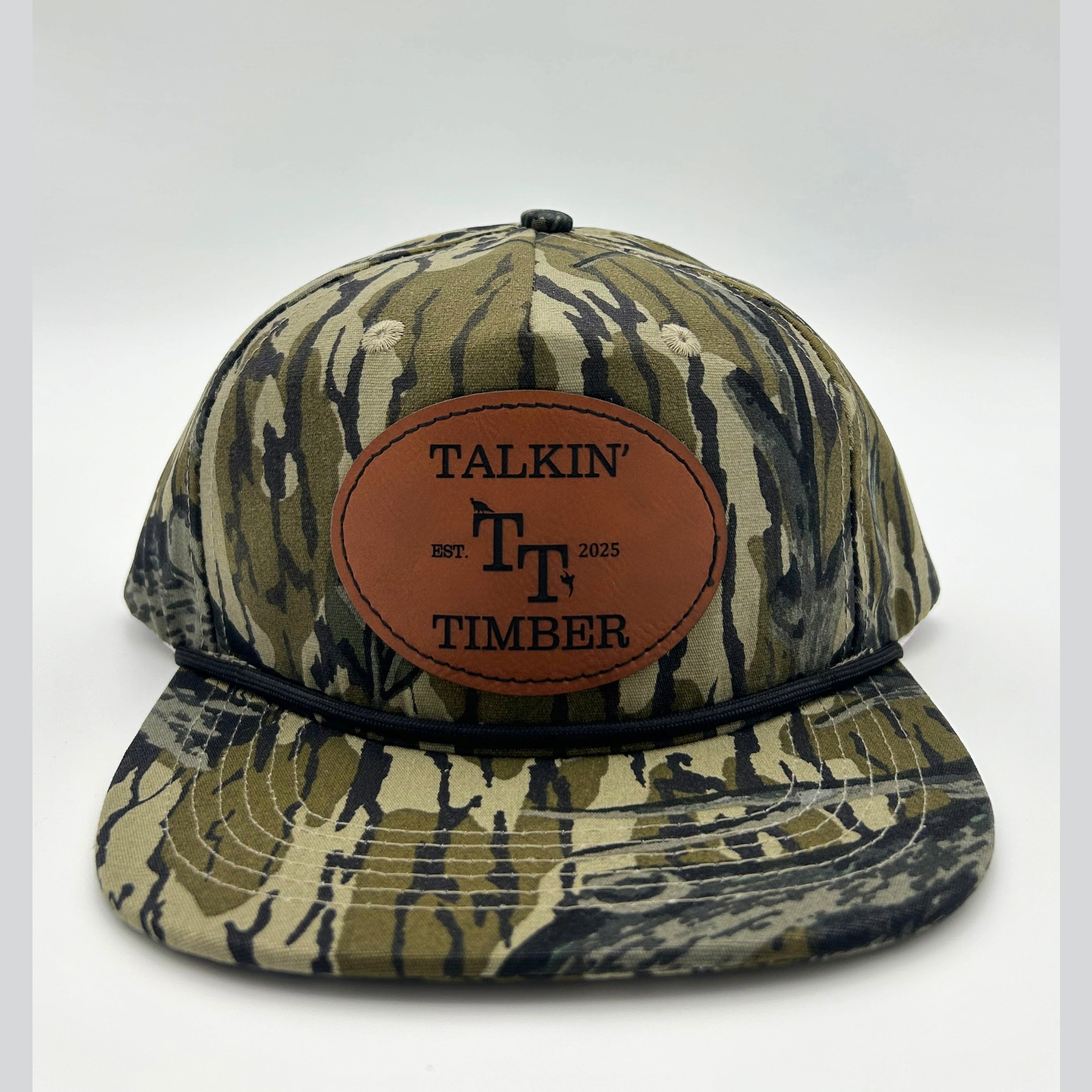 Front view of Mossy Oak Treestand™ rope hat with genuine leather patch and camouflage design, ideal for duck, turkey, and deer hunters.