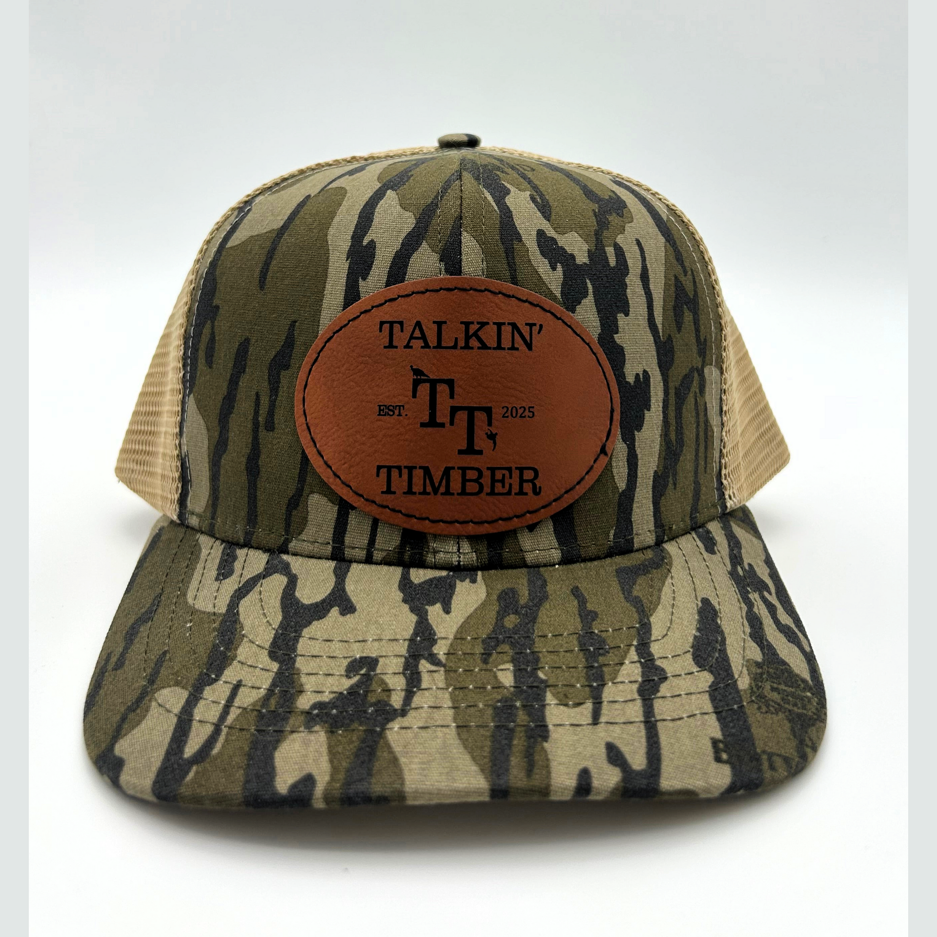 Front view of Mossy Oak Bottomland™ mesh back trucker hat with adjustable snapback closure and iconic camo pattern for all hunting and outdoor activities.