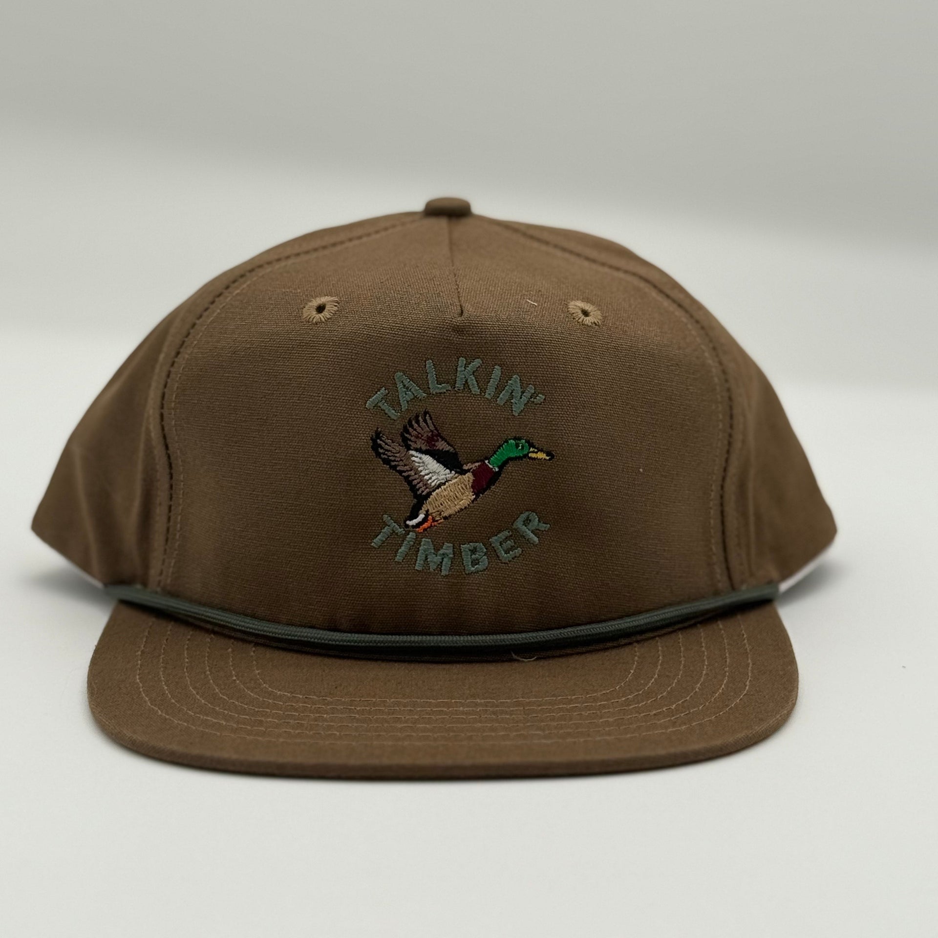 Brown cap with 'Talkin Timber' logo on a white background