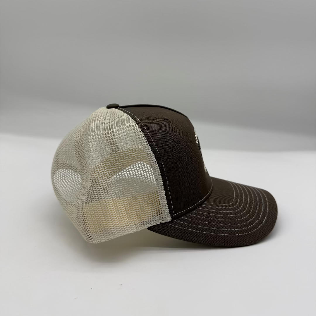 Brown and beige baseball cap on a white background