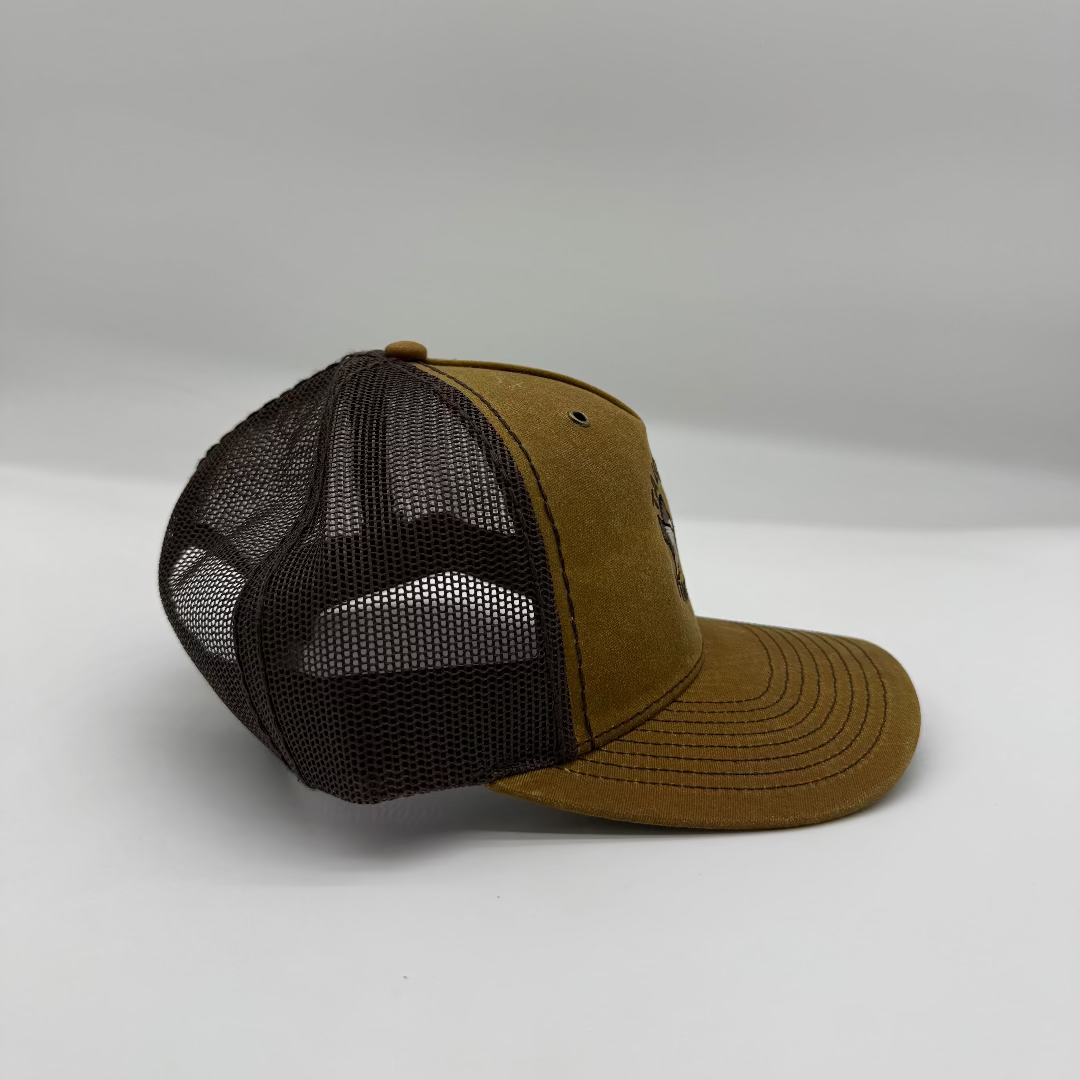 Brown and black mesh cap on a white background