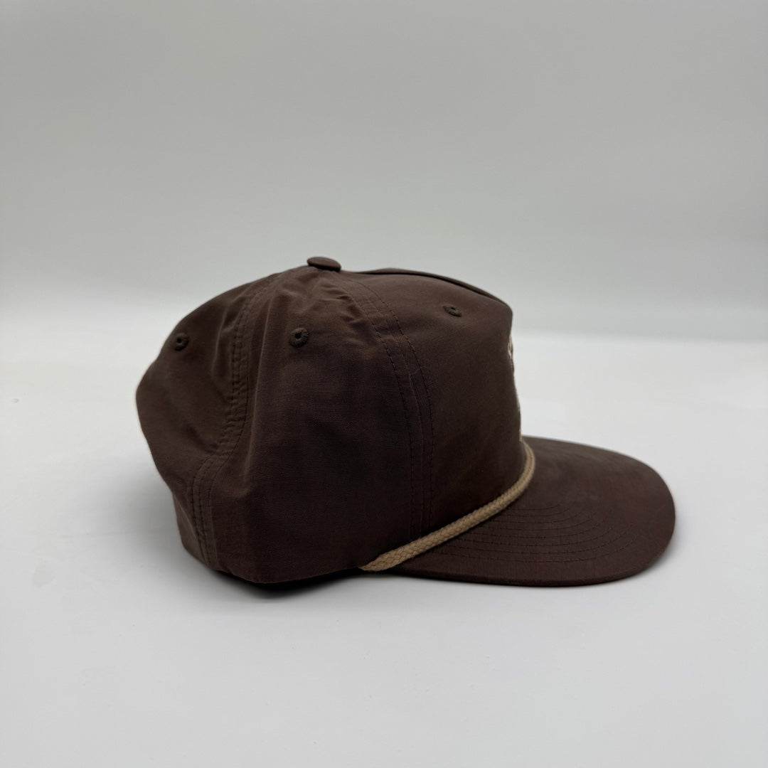 Side view of the Talkin’ Timber Brown Mallard Hat showing the brown crown, flat bill, and tan rope detail.