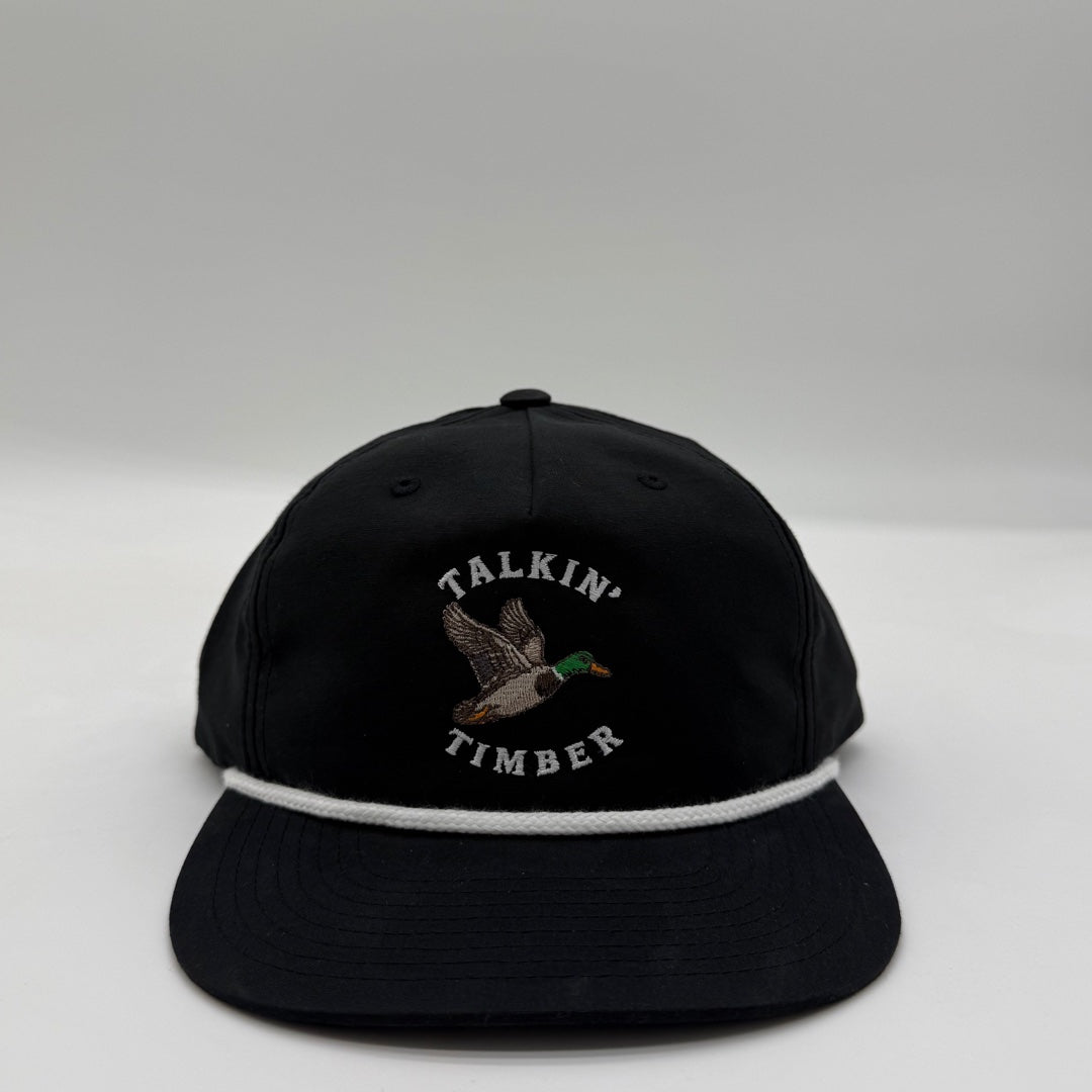 Front view of the Talkin’ Timber Black Mallard Hat with flying mallard embroidery, a black crown and bill, and white rope.
