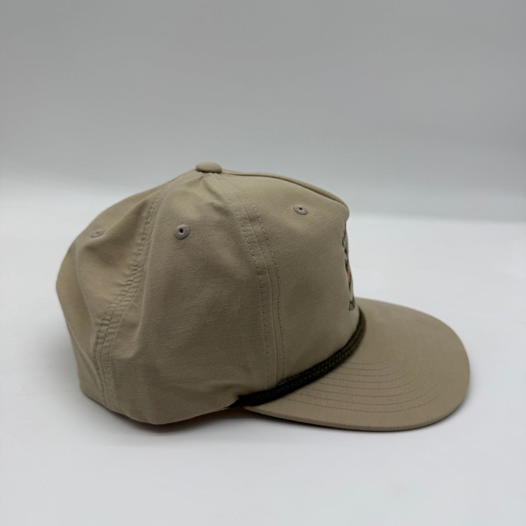 Side view of The Ram Hat by Talkin’ Timber showing the khaki crown, flat bill, and dark rope detail.