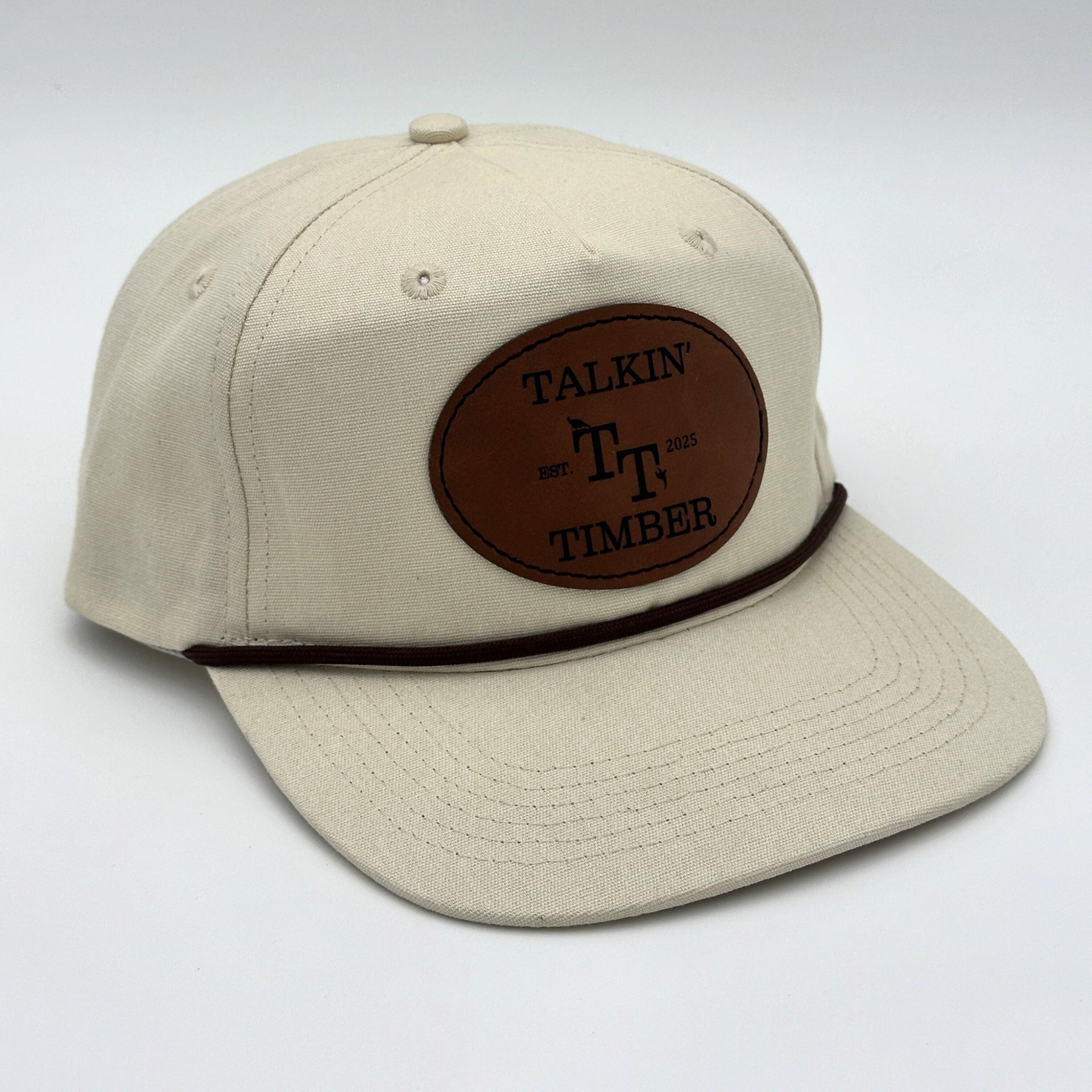 Angled view of Talkin’ Timber cream rope hat showing premium canvas texture, leather patch, and structured crown