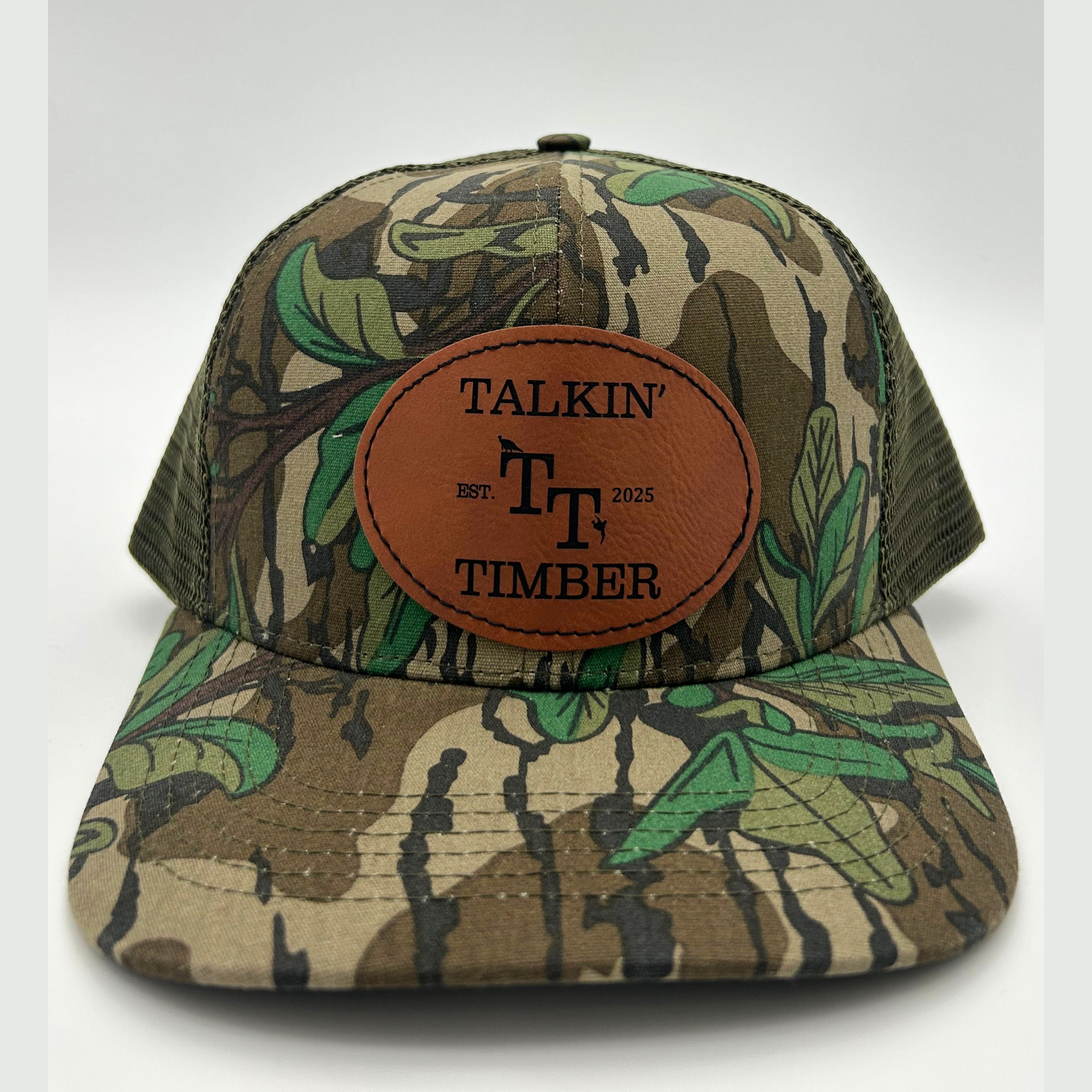 Mossy Oak Greenleaf™ olive mesh trucker hat featuring breathable mesh panels and classic camo design for hunters.